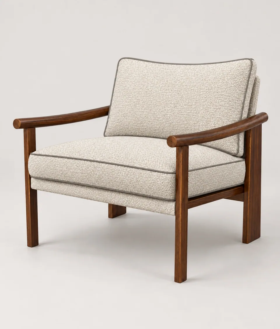 Mangeshi Arm Chair in cream weave, taupe piping with a dark-stained oak frame, front three-quarter view on a neutral studio background