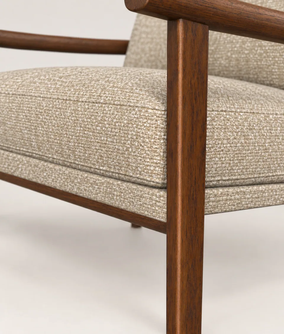 Mangeshi Arm Chair in sand bouclé with a dark-stained oak frame, close-up of the seat cushion corner with top-stitched border