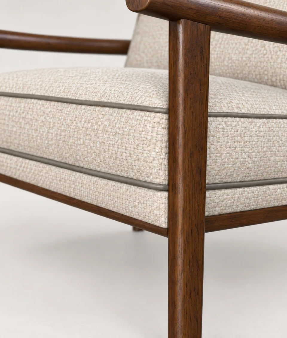 Close-up of the cream weave seat cushion with taupe piping and a dark-stained oak frame