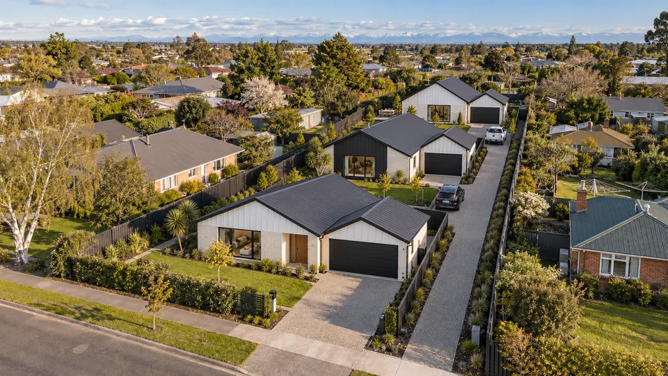 Early concept render of three new homes on the same section, from the same aerial viewpoint