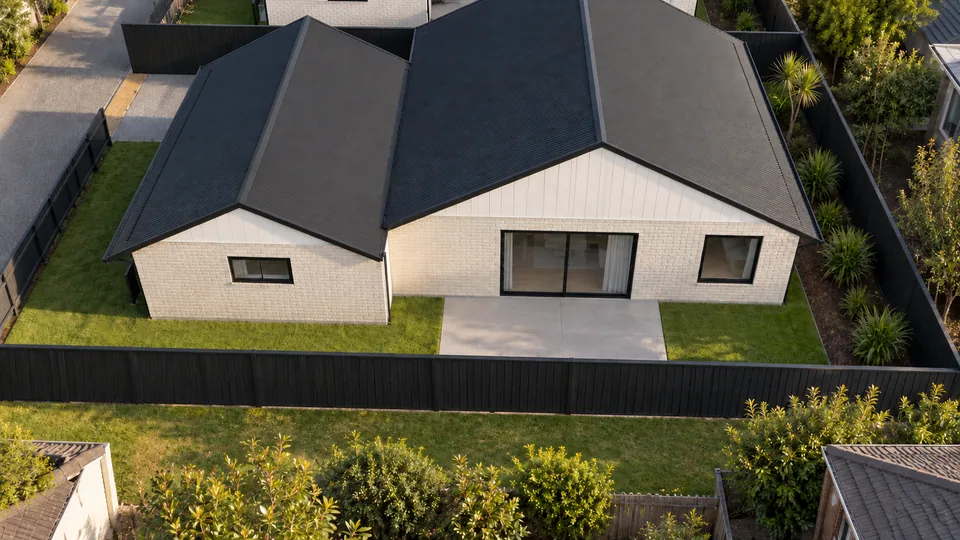 3D render of the rear lot home with a north-facing patio and lawn